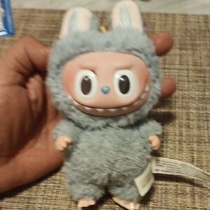 Gray Plush Toy with Blue Accents